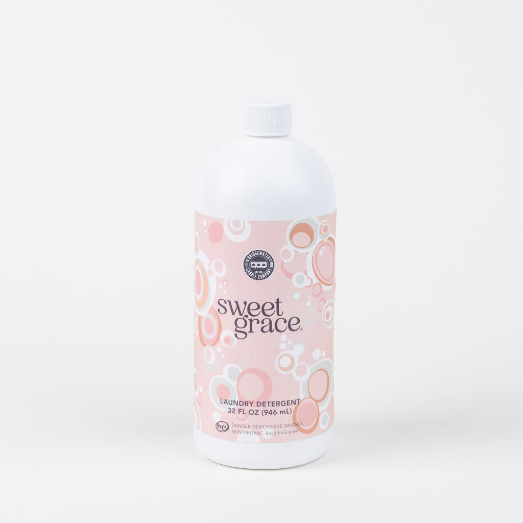 32oz bottle of Sweet Grace laundry detergent with a pink bubble-patterned label.
