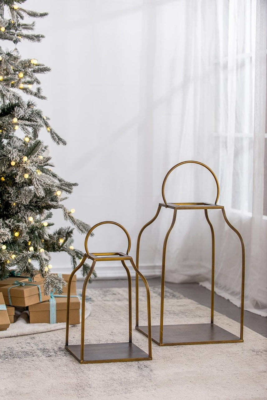 Antique gold iron lantern with a simple rectangular silhouette.