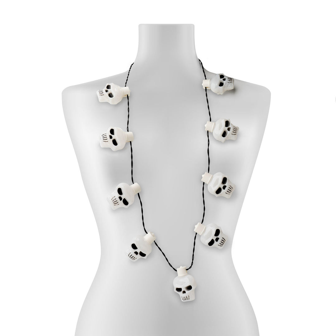 Lotsa Light Jumbo Flashing Halloween Necklace with nine white skull-shaped LEDs on a black cord.