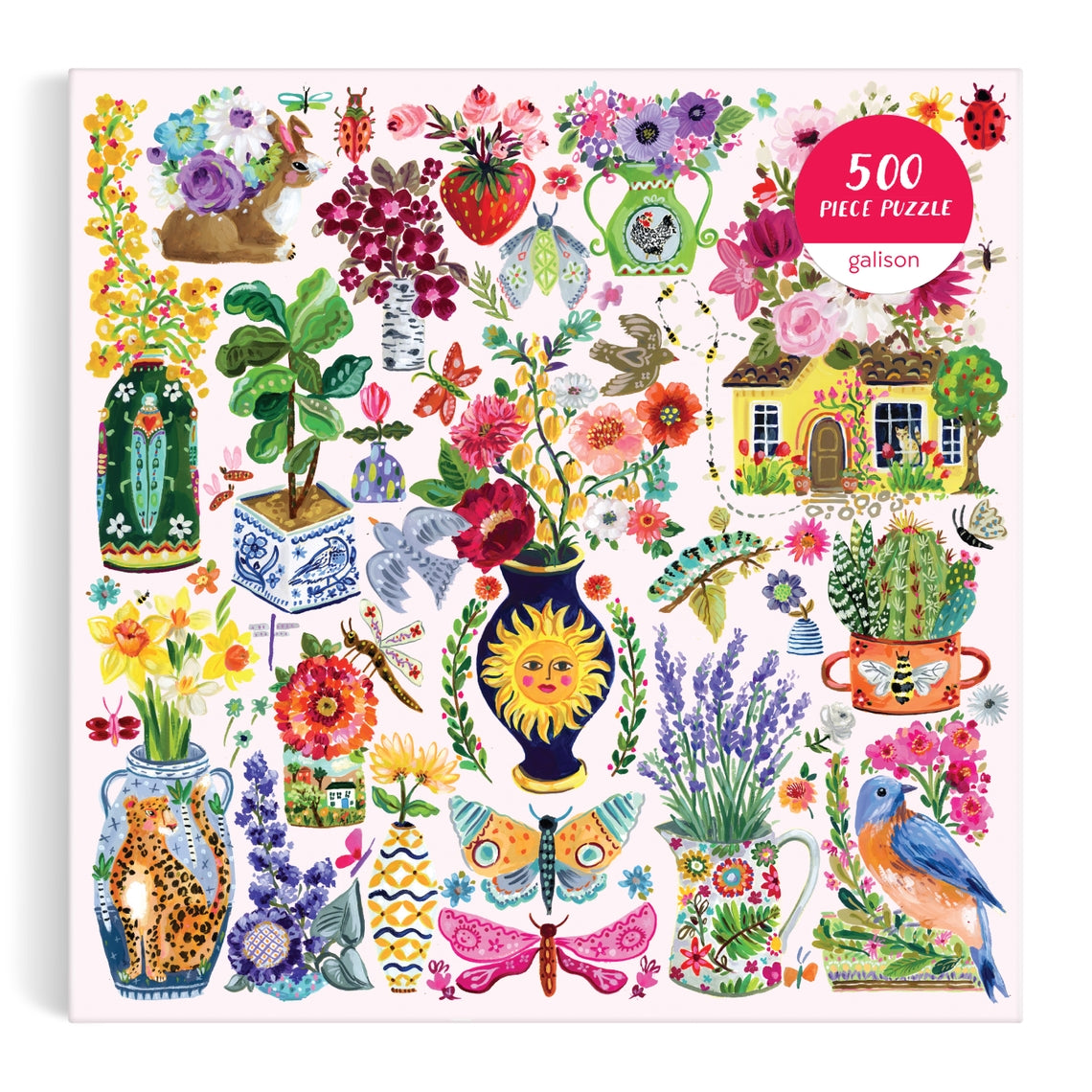 Buzzy Bouquets 500-piece puzzle featuring a whimsical garden scene with flowers, animals, and insects on a pink background.