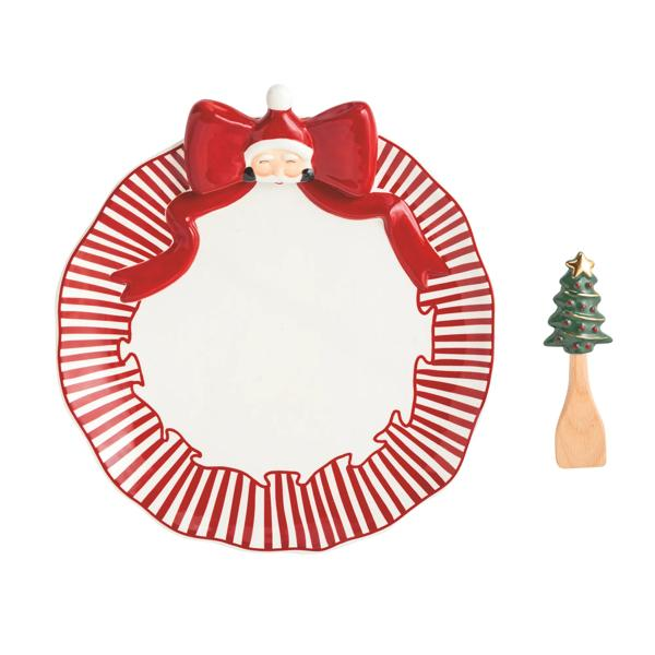 Santa Bow Cookie Plate Set with a red striped ceramic plate and a Christmas tree wooden spatula.