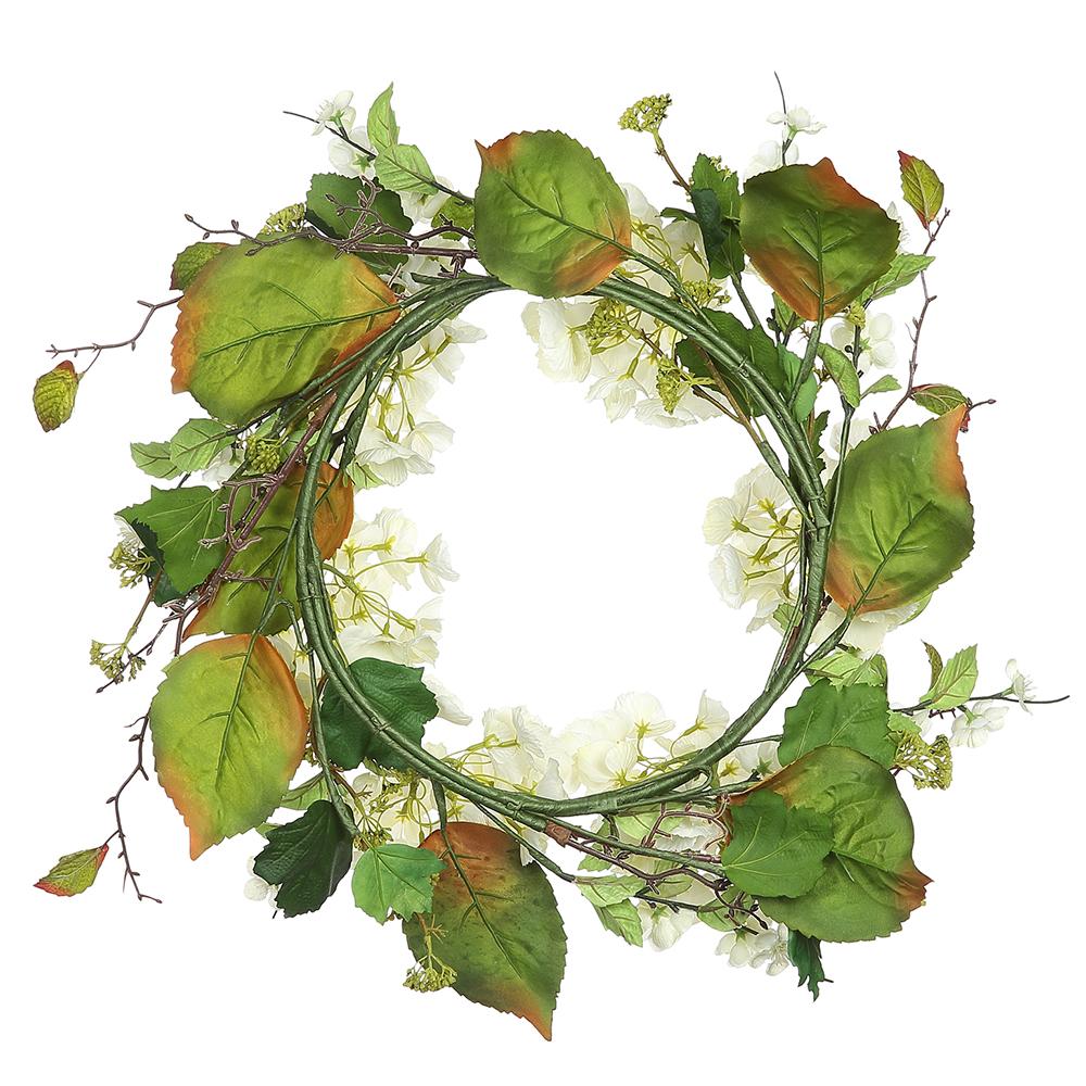 Cream green hydrangea wreath with plastic accents on a cream background