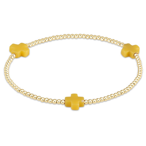 Signature Cross gold-filled bracelet with a cross bead pattern on elastic cord