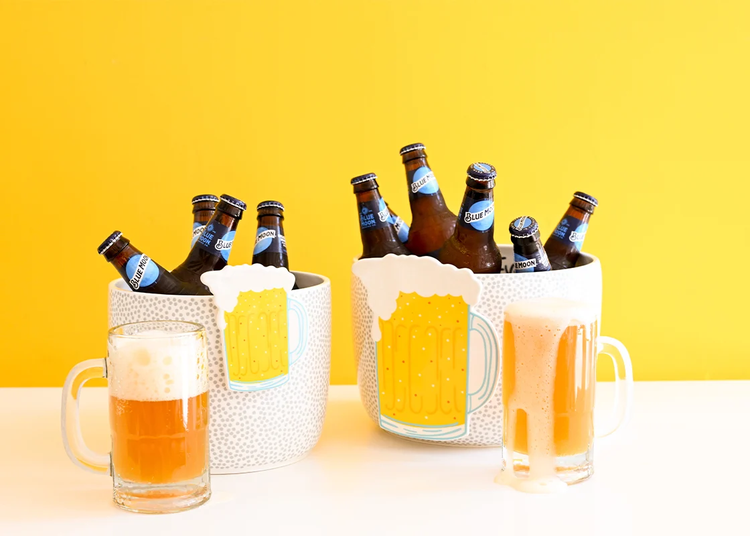 Beer Mug Mini Attachment on a white and grey dotted bucket filled with Blue Moon beer bottles.