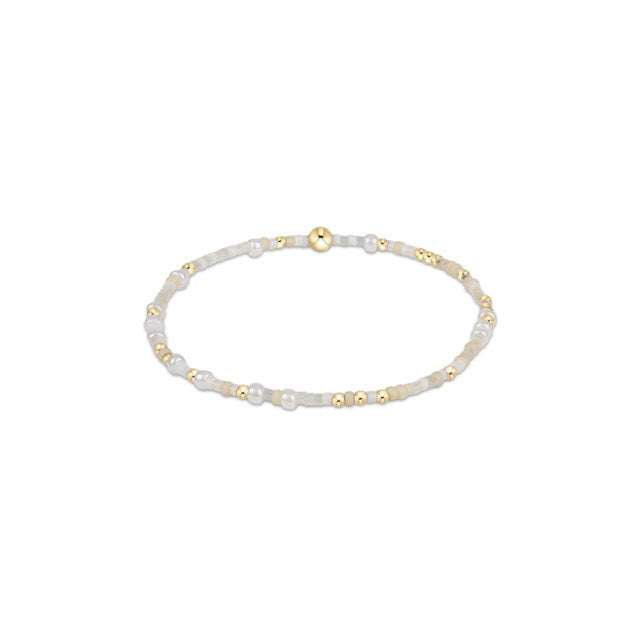Hope Unwritten bracelet featuring mixed seed beads in various colors with gold-filled accents on elastic cord.