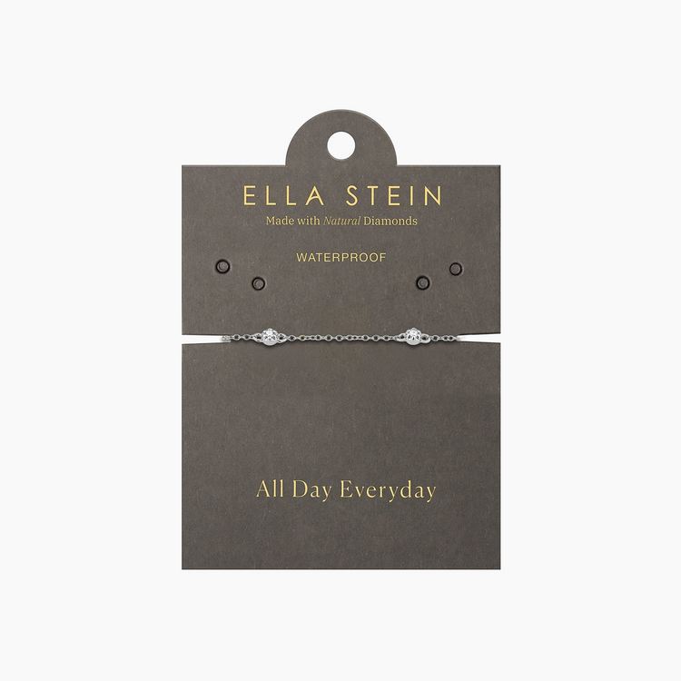 Silver Ara Chain Bracelet with two small diamonds on a grey Ella Stein display card.