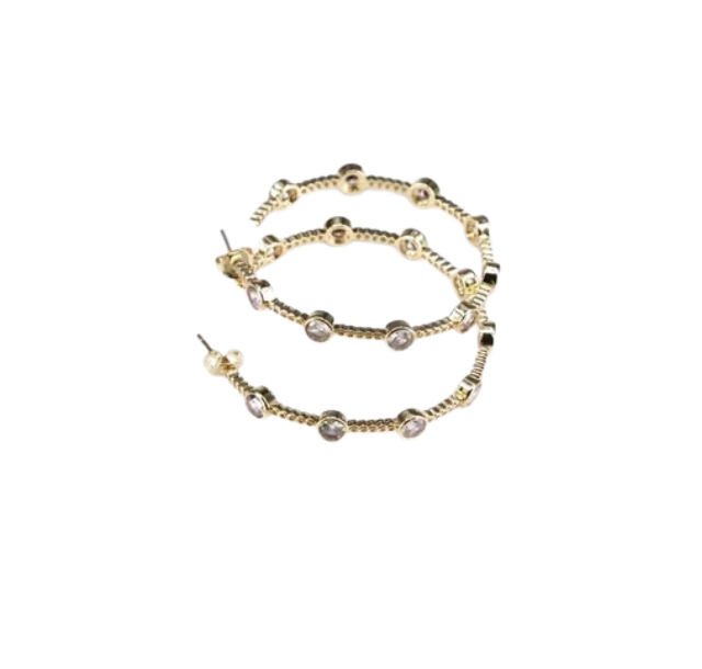 Gold Stargazer Station Hoops featuring a twisted metal design with bezel-set clear crystals.