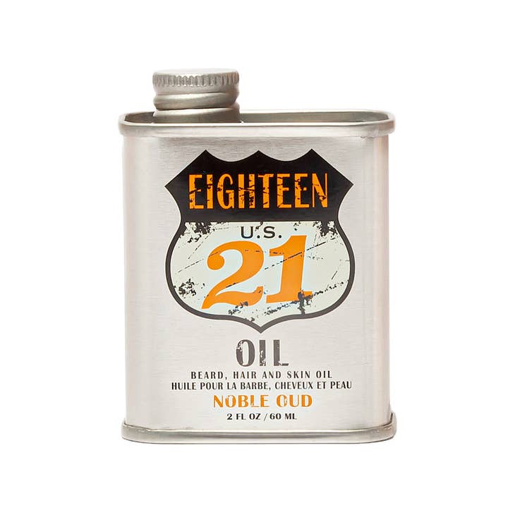 Bottle of Beard Hair and Skin Oil with amber liquid inside