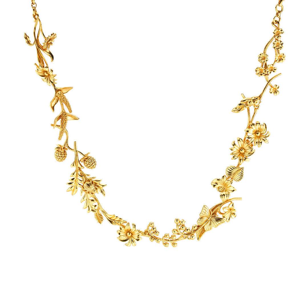 Gold plated brass necklace featuring a meadow wildflower pendant on an 18-inch chain.