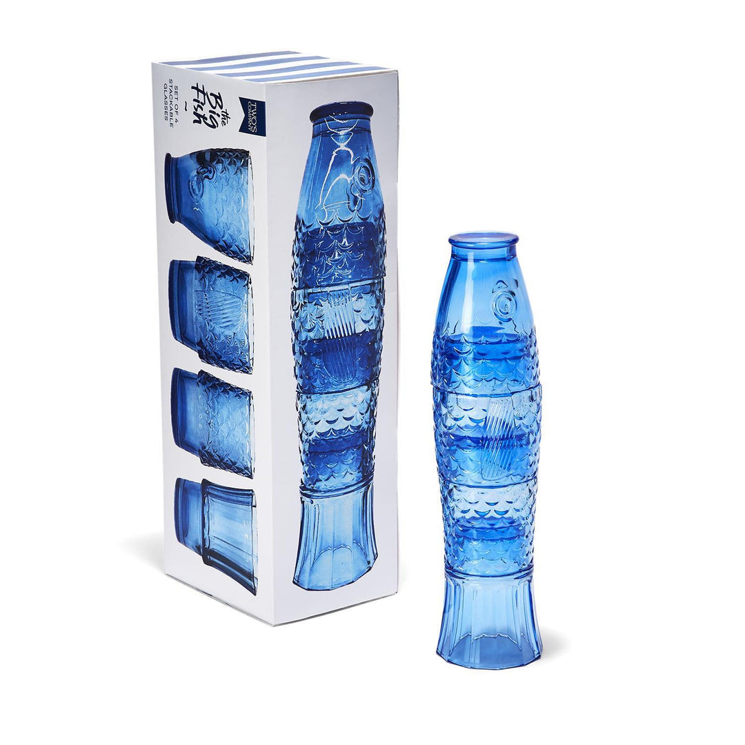 Set of four blue stackable fish-shaped glasses shown next to their decorative gift box.