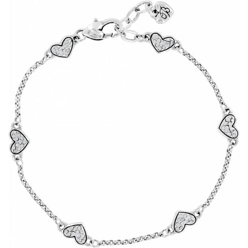 Silver plated Kiss & Tell Anklet with six crystal-encrusted heart charms and a lobster claw clasp.