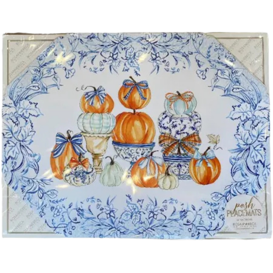 Die-cut paper placemat featuring a blue and white botanical border with a central pumpkin display.