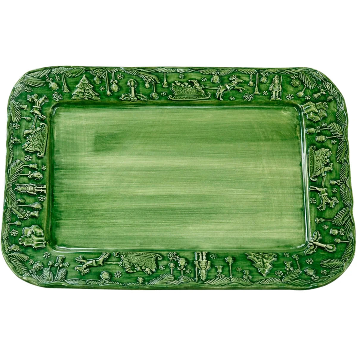 Green rectangular stoneware platter with hand-sculpted holiday scenes and a festive border.