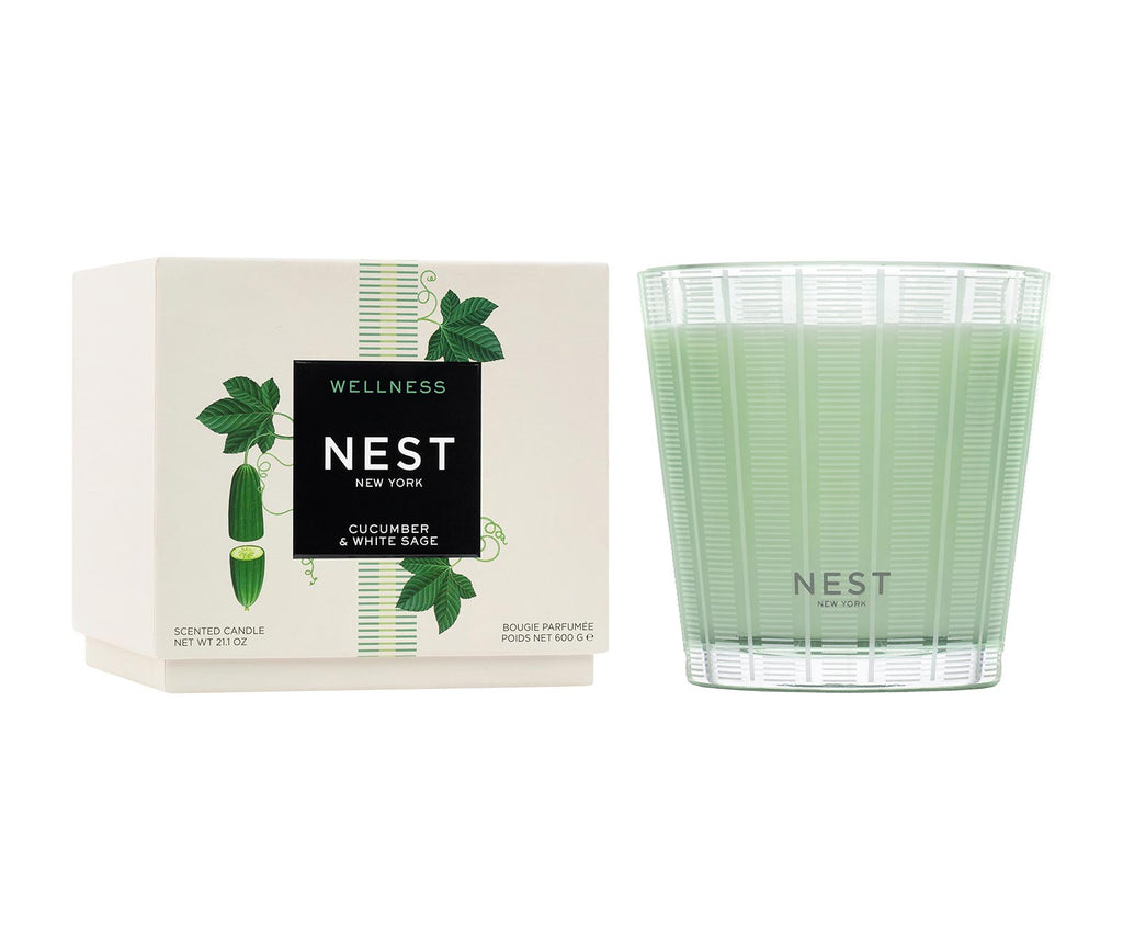 Nest three-wick candle in a cylindrical glass jar with neutral-colored wax.