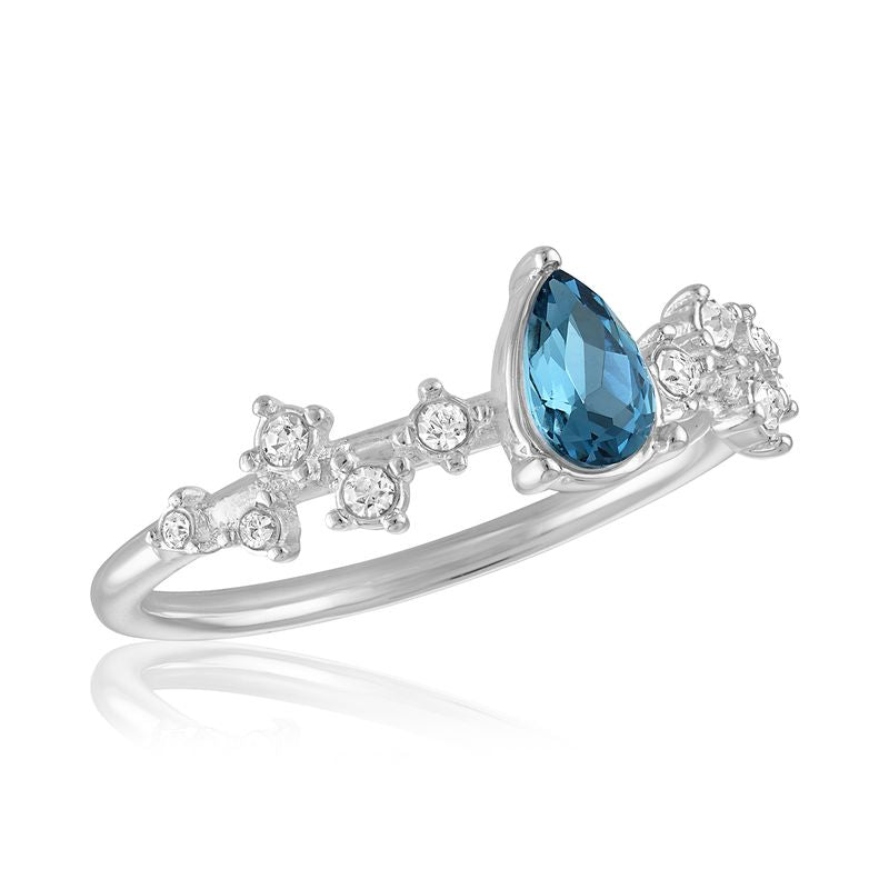 Elegant silver stack ring featuring a Montana blue teardrop stone and clear round accents.