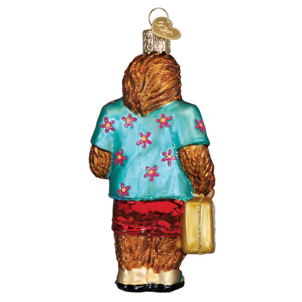 Sasquatch Gone Tropics ornament: Bigfoot figure in sunglasses with flip-flops on a tropical beach background.