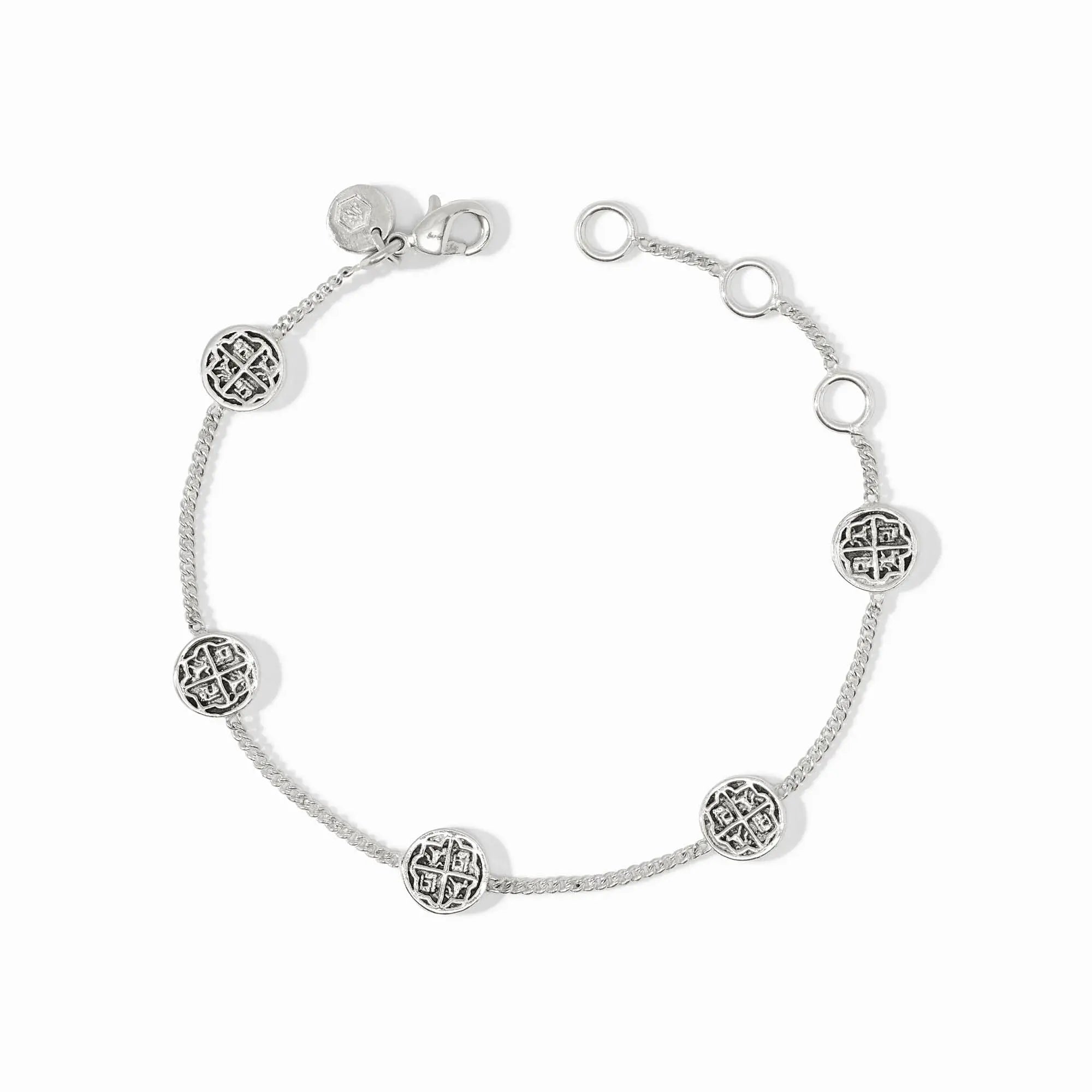 Delicate silver chain bracelet with five small coin stations on an adjustable length.