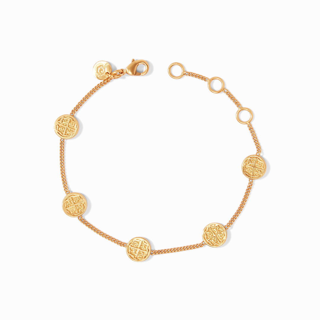 Delicate gold chain bracelet with five small coin charms
