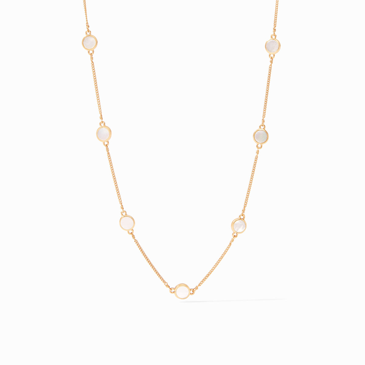 Gold-plated necklace with nine mother-of-pearl stations on an adjustable chain.
