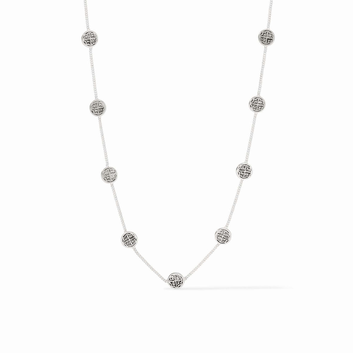 Silver necklace with nine delicate coin stations on an adjustable fine chain.