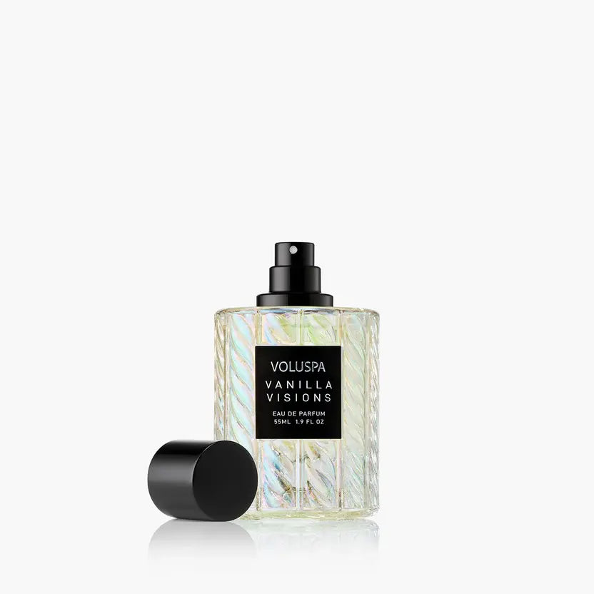 Vanilla Visions Eau De Parfum bottle with a clear glass body, amber liquid inside, and a silver cap.