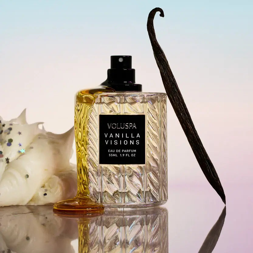 Glass bottle of Vanilla Visions Eau De Parfum with a gold cap.