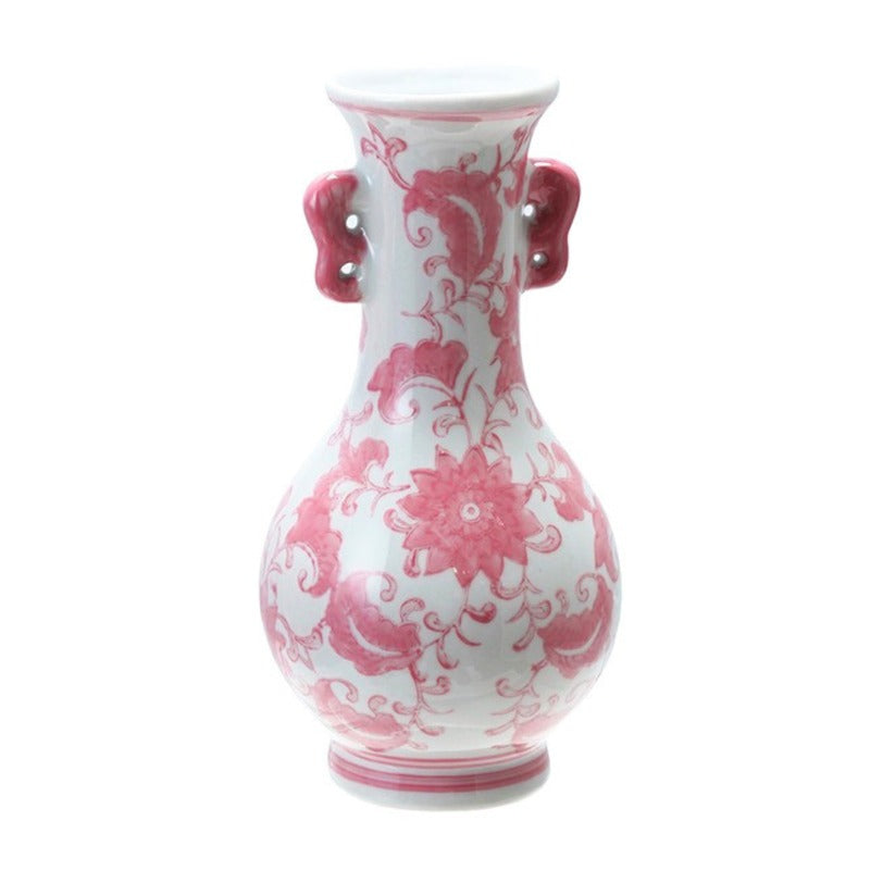 White stoneware vase with pink floral patterns and small side handles, 7 inches tall.