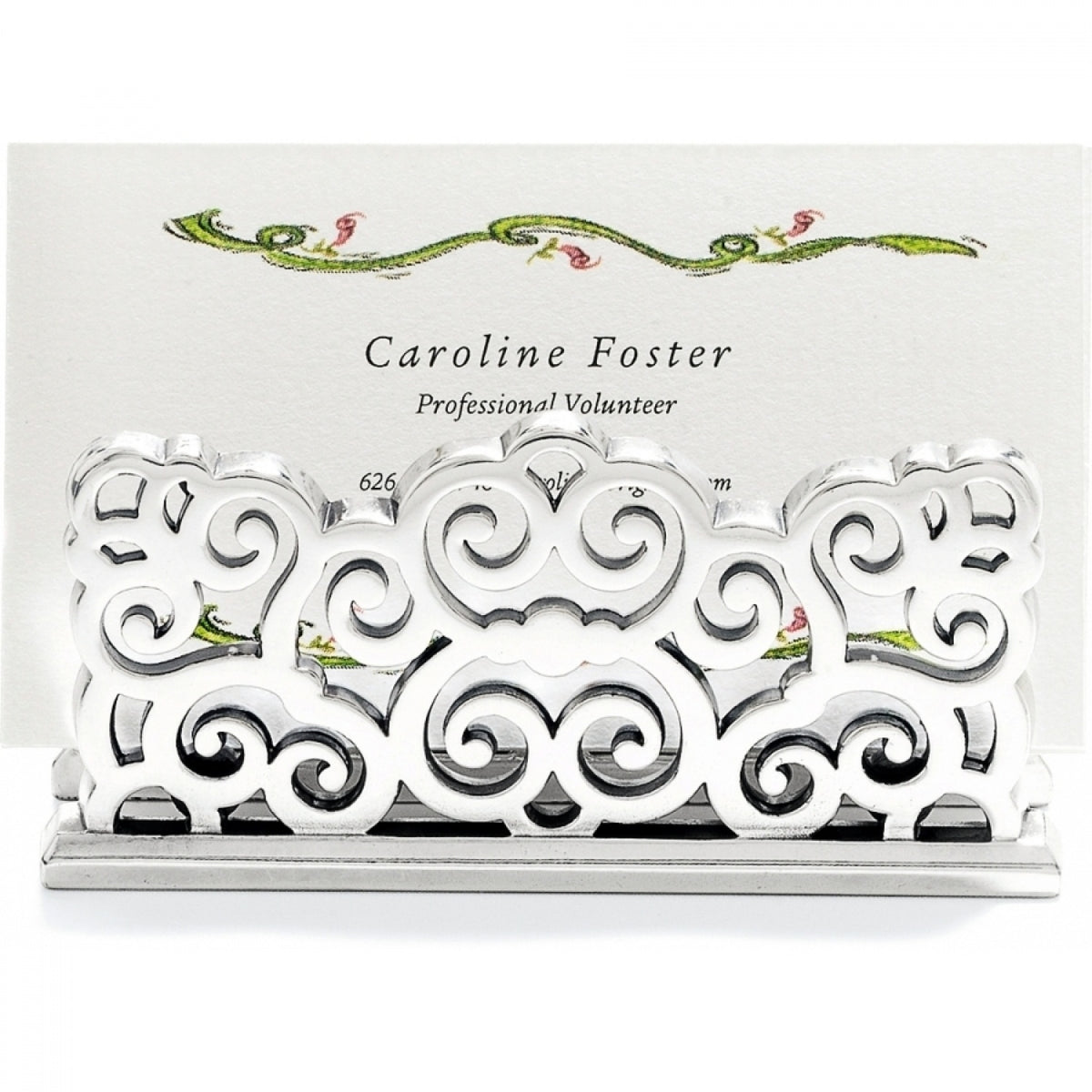 Silver plated Geneva Card Holder with intricate scrollwork design holding a business card.