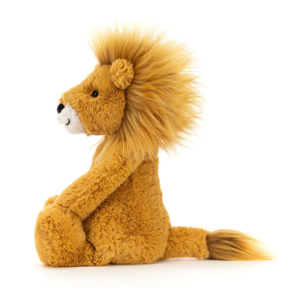 Bashful Lion Medium plush toy in beige polyester with acrylic mane sitting on a soft base.