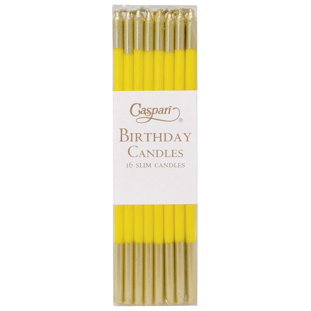 Caspari set of 16 slim yellow birthday candles with gold glitter tips in a clear box.
