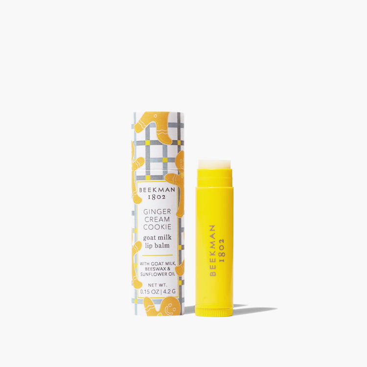 Beekman Lip Balm in a clear paper tube with gingham pattern packaging.