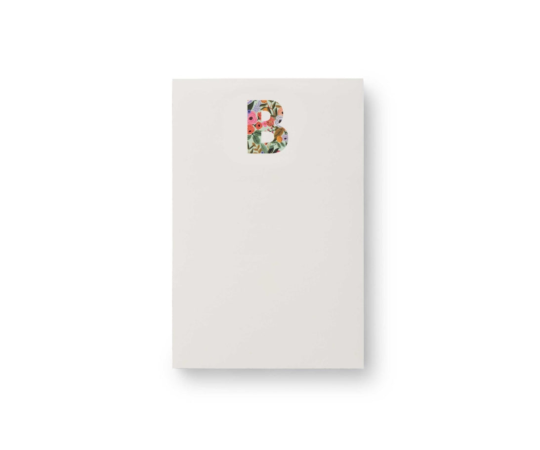 Garden Party monogram notepad with tear-off sheets in a floral pattern.
