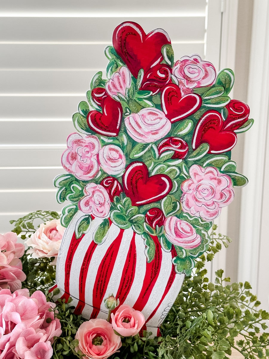 Martin's Potted Bouquet easel in a natural wood finish with green foliage and white flowers.