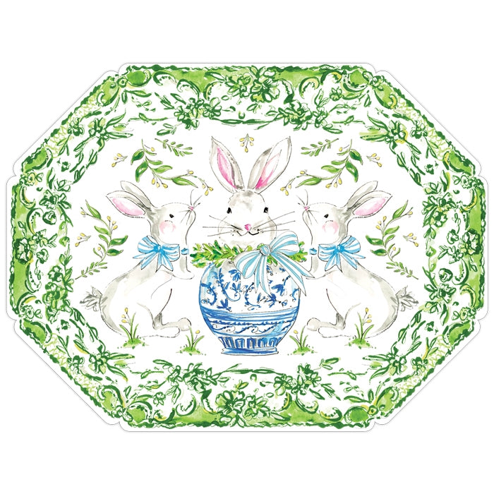 Posh die-cut paper placemat in white with a scalloped silhouette framing dinnerware.