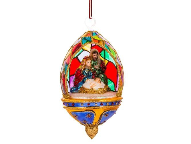 Hand-painted glass dome ornament featuring the Holy Family with colorful stained-glass patterns.