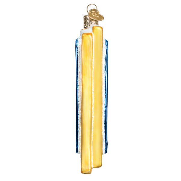 Side view of a glass Passport Ornament with blue, white, and gold vertical stripes and glitter.