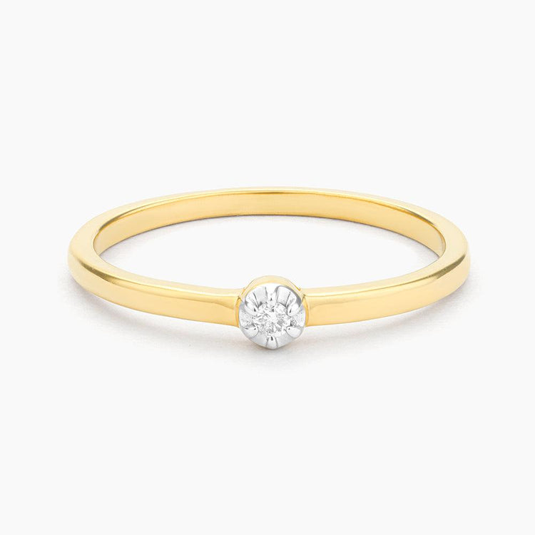 Stackable ring with a diamond centerpiece surrounded by smaller diamonds in silver metal.