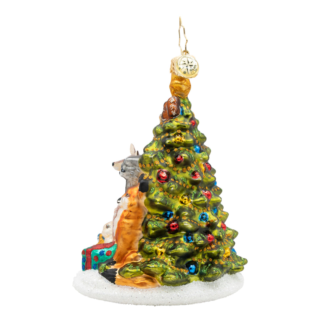Woodland Celebration glass ornament featuring forest animals gathered around a decorated tree.