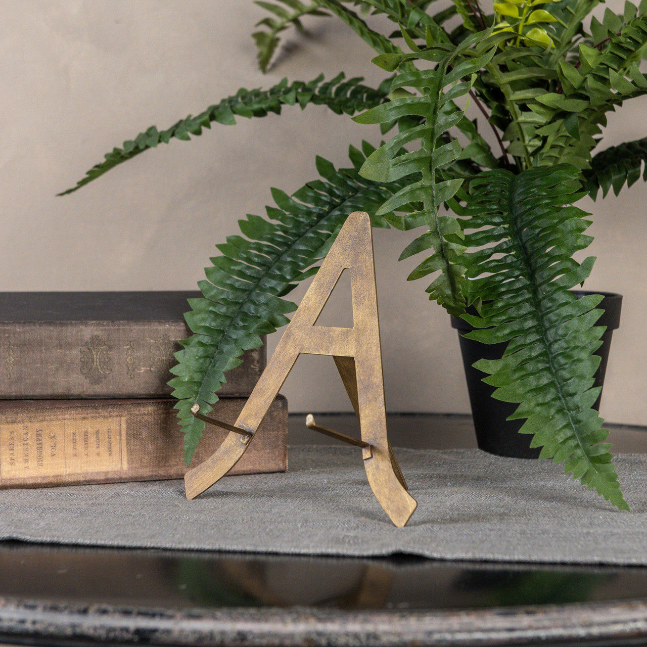Bronze metal plate stand with dimensions L:6.5in W:2.5in H:7.25in