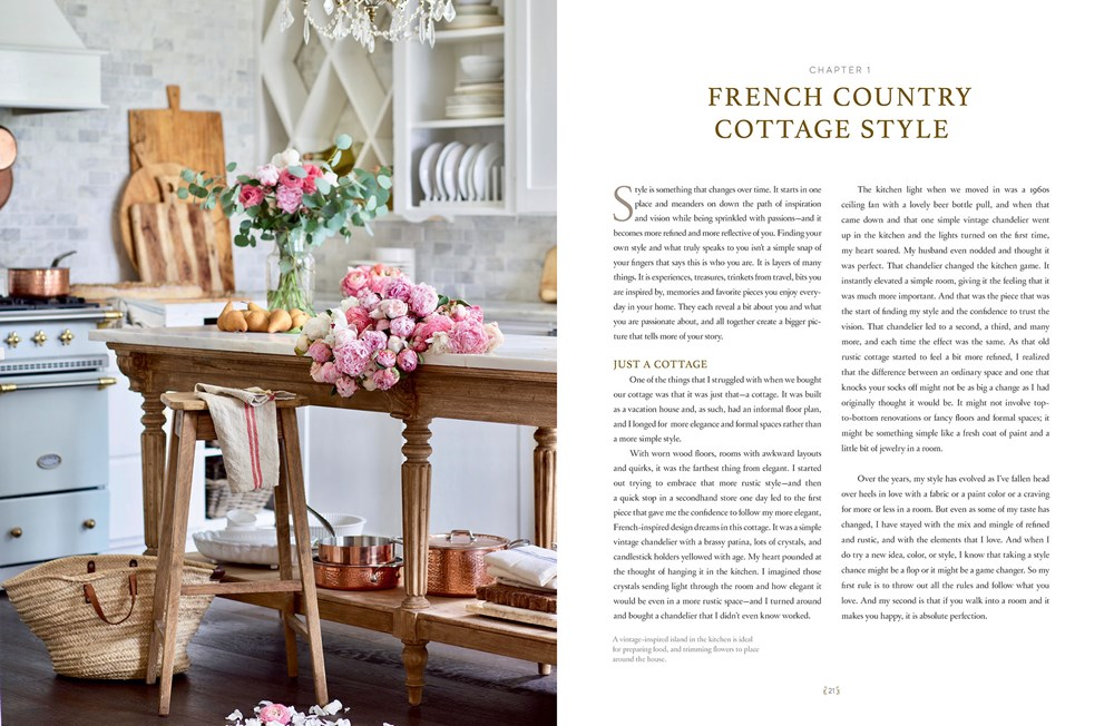 Open book titled French Country Cottage Style showing a rustic kitchen island with pink flowers.