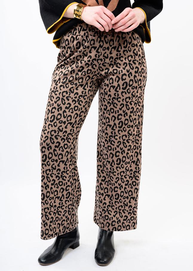 Woman wearing Hannah Knit Pull On Pants in a brown and black leopard print with black ankle boots.