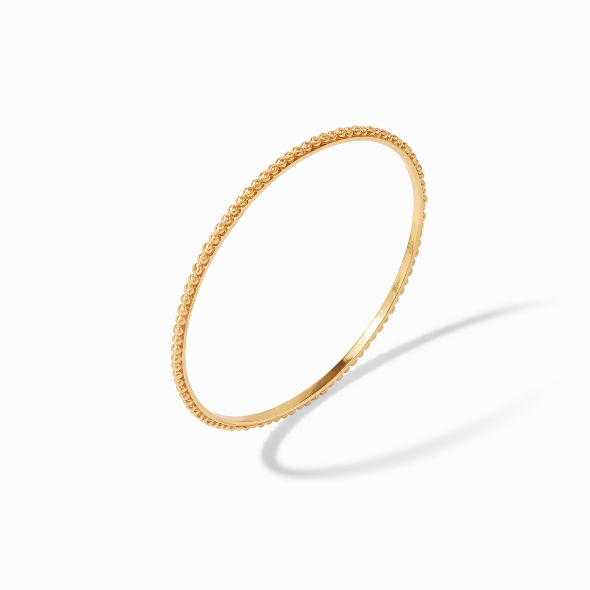 Slender gold-plated bangle with raised bead detail and Julie Vos hallmark.