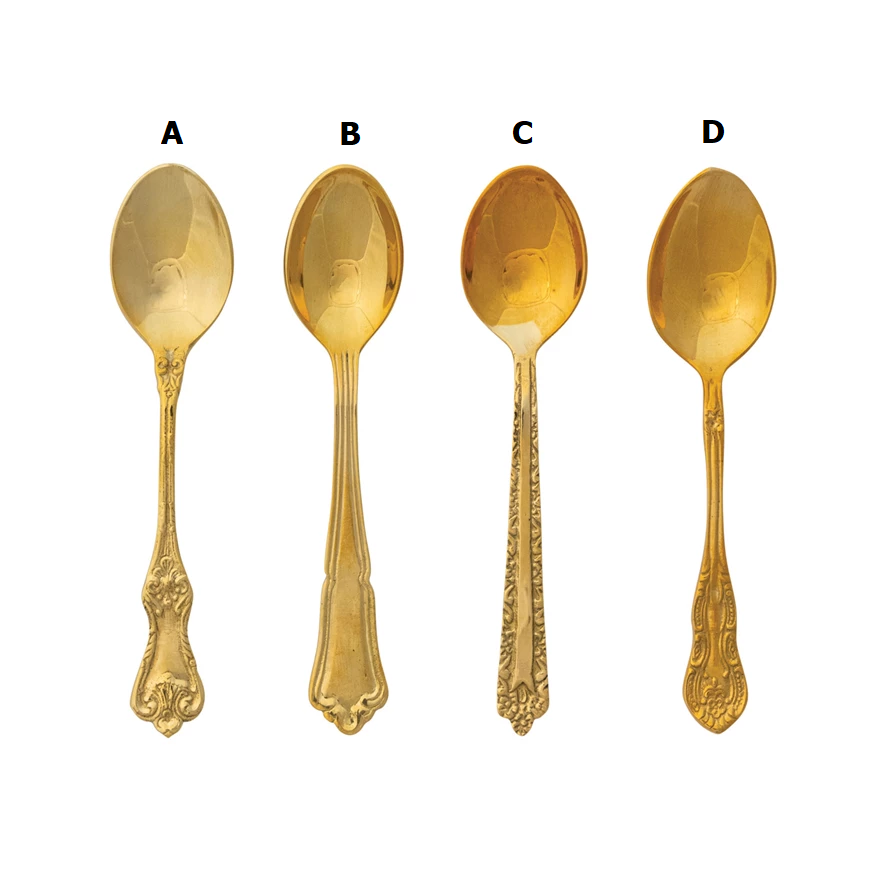 Embossed brass spoon with textured surface and elongated handle.