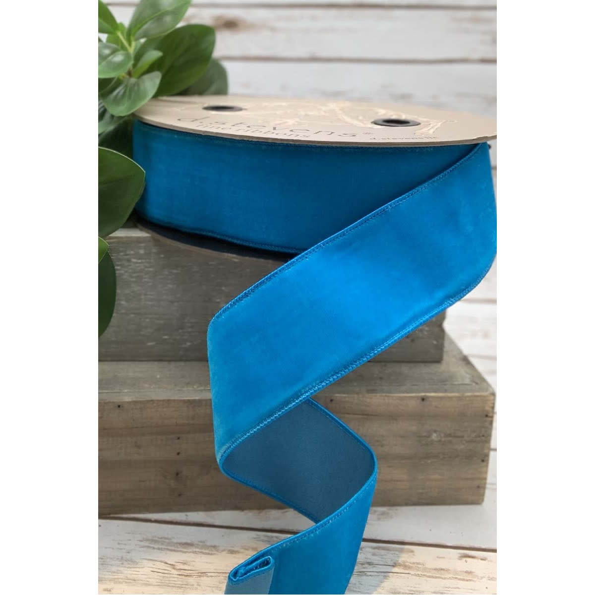 2.5-inch wide blue velvet ribbon with a faux dupion back on a spool.
