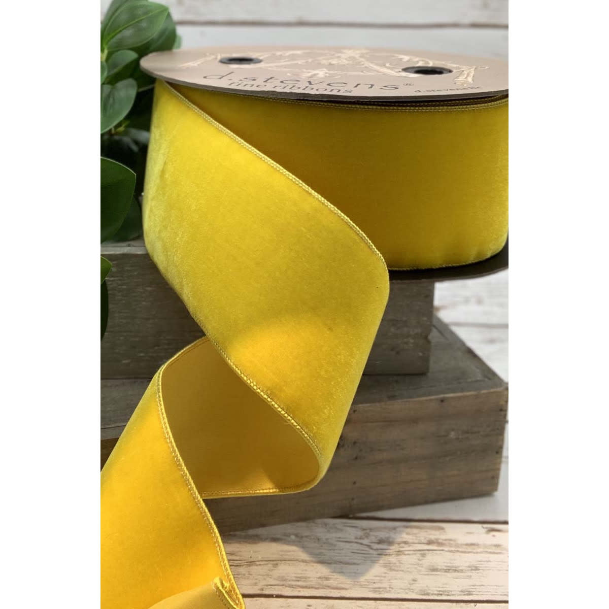 Bright yellow velvet ribbon with faux dupion backing on a D Stevens spool.