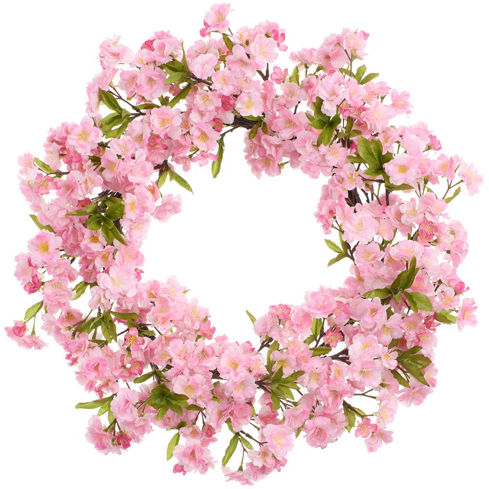 Round cherry blossom wreath with pink floral patterns on a metal wire frame.