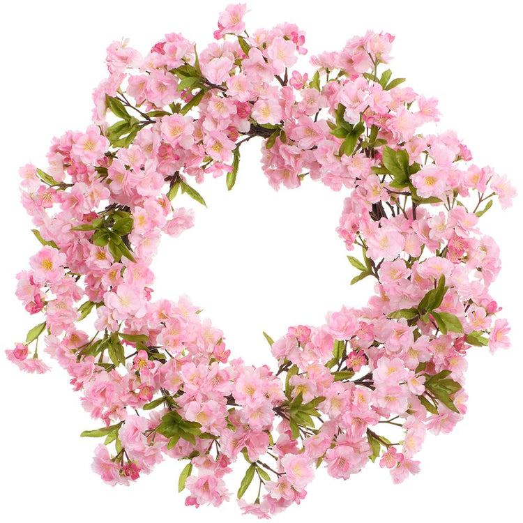 Round cherry blossom wreath with pink floral patterns on a metal wire frame.