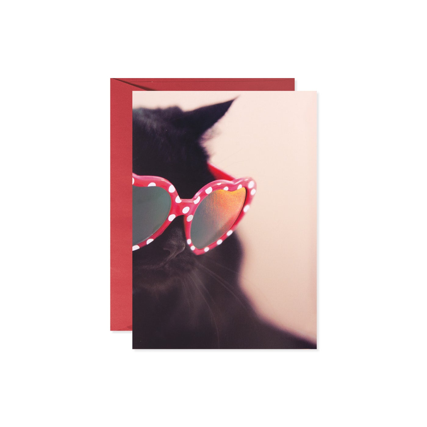 Heart-shaped cat face sunglasses with a black frame.