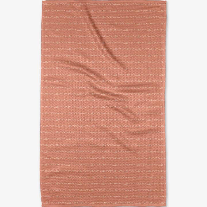 Waffle weave kitchen tea towel with single-sided print hang loop