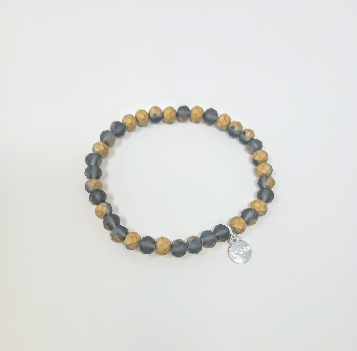 Stretchy bracelet with faceted glass beads in a colorful beaded pattern.